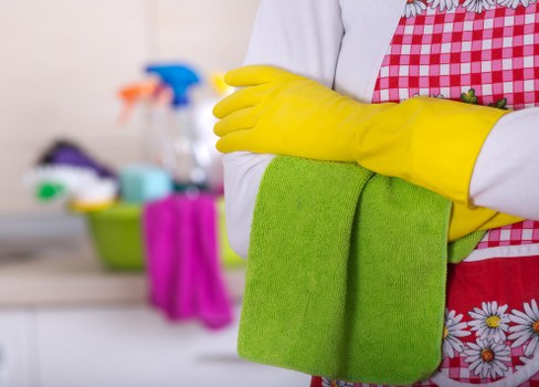 Professional mattress cleaning service preparing a bed